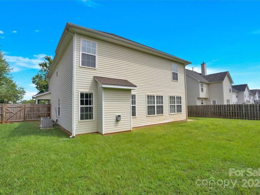 280 Glenn Allen Road, Mooresville, NC 28115.  MLS# CAR4273655, YatesRealty ID 22142. Fenced flat back yard w/ concrete patio to right side of home.