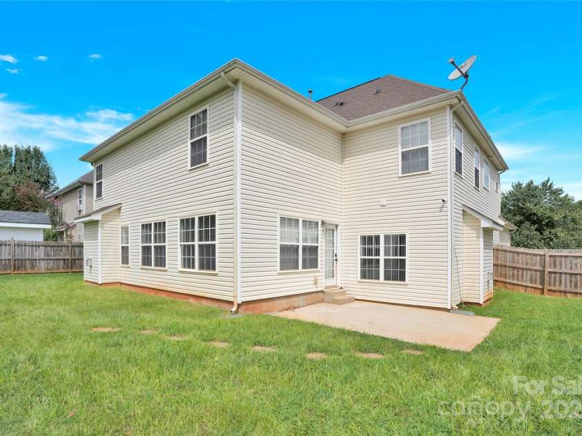 280 Glenn Allen Road, Mooresville, NC 28115.  MLS# CAR4273655, YatesRealty ID 22142. Fenced flat back yard w/ concrete patio to right side of home.
