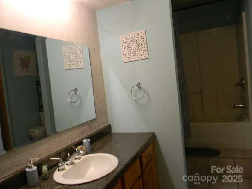 1425 Sorrells Cove Road, Clyde, NC 28721.  MLS# CAR4274048, YatesRealty ID 22147. Jack & Jill Bathroom