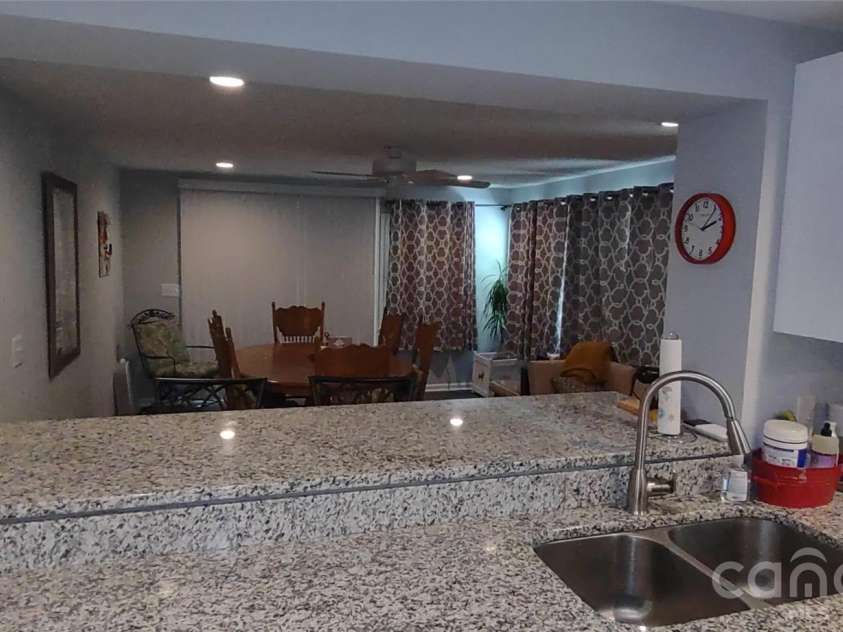 769 Dennis Road, Troy, NC 27371.  MLS# CAR4374021, YatesRealty ID 22151. Kitchen pass through bar to dining room
