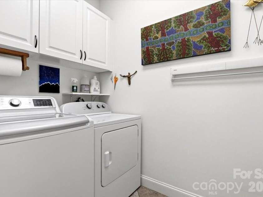 15 Quail Hollow Drive, Arden, NC 28704.  MLS# CAR4372474, YatesRealty ID 22155. Main floor laundry with storage