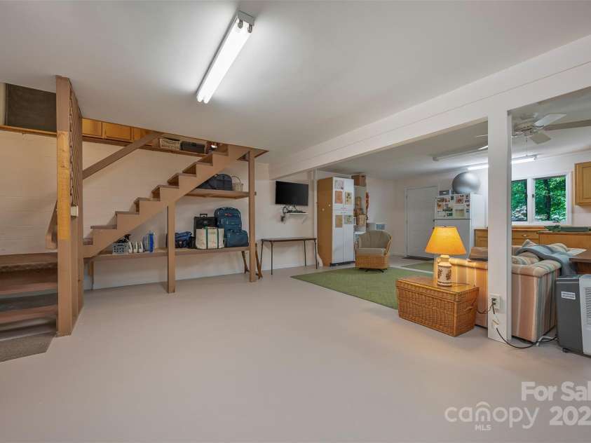 172 Overlook Drive, Flat Rock, NC 28731.  MLS# CAR4224391, YatesRealty ID 2217. Lower level second stairway goes up to kitchen