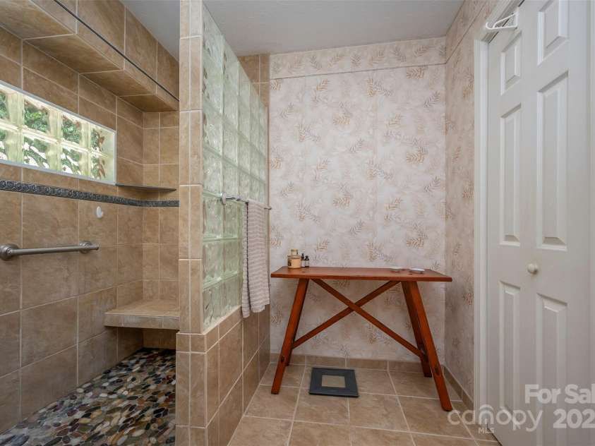 172 Overlook Drive, Flat Rock, NC 28731.  MLS# CAR4224391, YatesRealty ID 2217. Primary bath walk-in shower