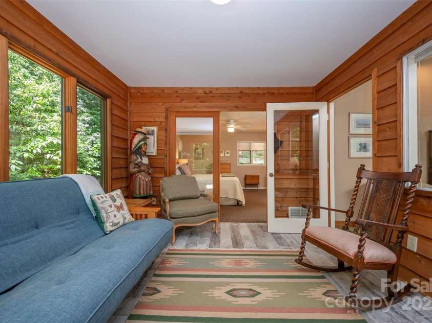 172 Overlook Drive, Flat Rock, NC 28731.  MLS# CAR4224391, YatesRealty ID 2217. Sunroom looking into primary bedroom