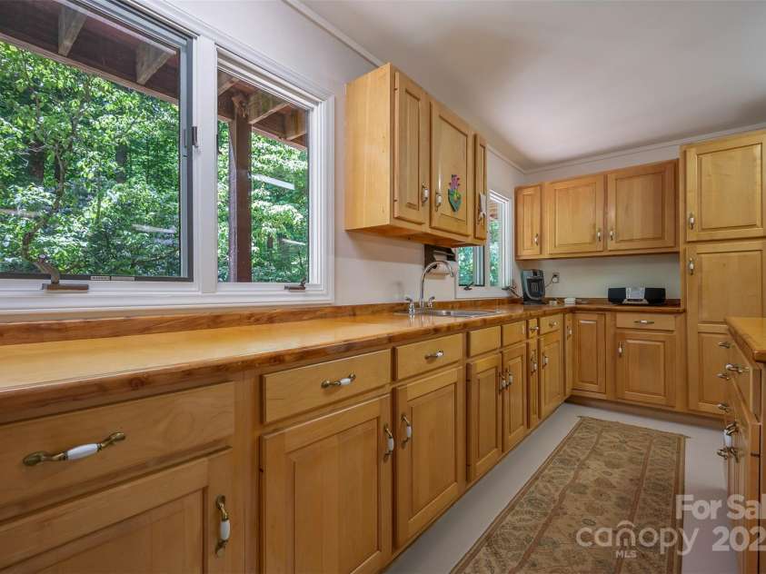 172 Overlook Drive, Flat Rock, NC 28731.  MLS# CAR4224391, YatesRealty ID 2217. Unfinished area of lower level would be great for crafts, storage - you decide!