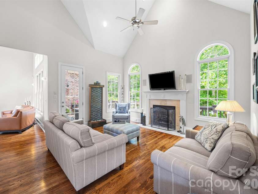 5826 Natoma Road, Clover, SC 29710.  MLS# CAR4372920, YatesRealty ID 22174. Family room with solid wood flooring and exit to rear deck