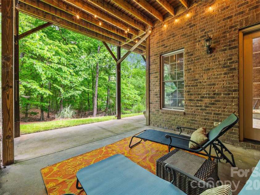 5826 Natoma Road, Clover, SC 29710.  MLS# CAR4372920, YatesRealty ID 22174. Patio off basement entry