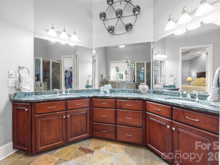 5826 Natoma Road, Clover, SC 29710.  MLS# CAR4372920, YatesRealty ID 22174. Primary bath with double vanities and vaulted ceiling
