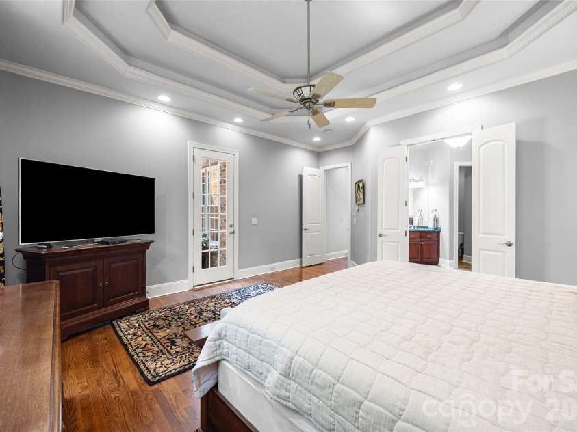 5826 Natoma Road, Clover, SC 29710.  MLS# CAR4372920, YatesRealty ID 22174. Spacious, bright primary suite with exit to rear deck