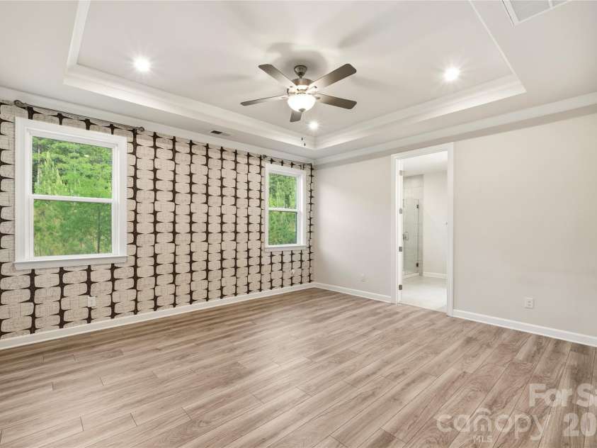 9534 Liberty Hill Drive, Mint Hill, NC 28227.  MLS# CAR4378048, YatesRealty ID 22183. Primary BR with wallpaper accent wall