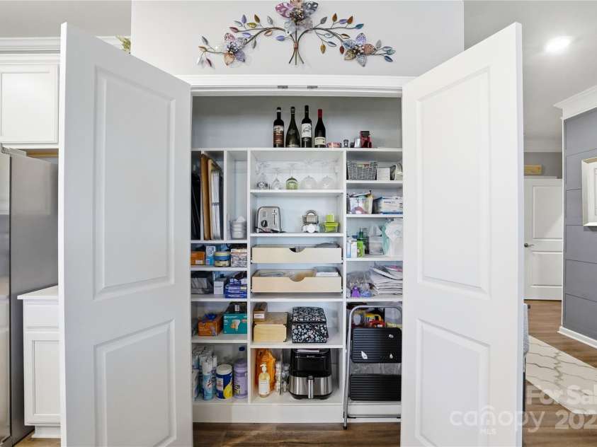 1224 Dali Boulevard, Mount Holly, NC 28120.  MLS# CAR4274726, YatesRealty ID 22189. Custom SECOND pantry with ample shelving and pull out drawers.
