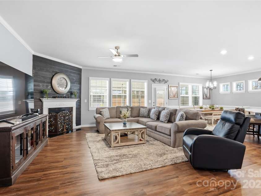 1224 Dali Boulevard, Mount Holly, NC 28120.  MLS# CAR4274726, YatesRealty ID 22189. Living room boasting natural light, plantation shutters thru-out and ceiling fan.