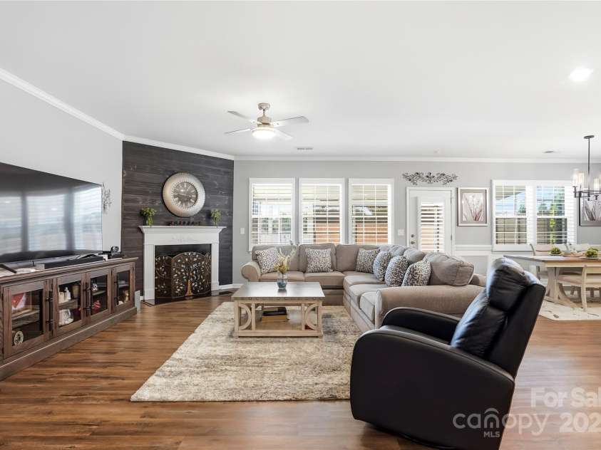 1224 Dali Boulevard, Mount Holly, NC 28120.  MLS# CAR4274726, YatesRealty ID 22189. Open and bright living room with plantation shutters.