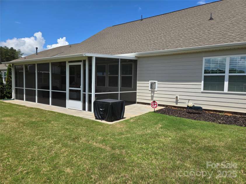 1224 Dali Boulevard, Mount Holly, NC 28120.  MLS# CAR4274726, YatesRealty ID 22189. Screened porch backyard