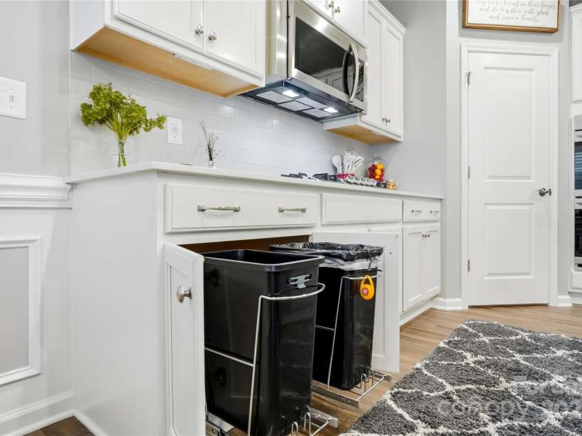 1224 Dali Boulevard, Mount Holly, NC 28120.  MLS# CAR4274726, YatesRealty ID 22189. Under counter dual trash pails that remain hidden with pull outs.