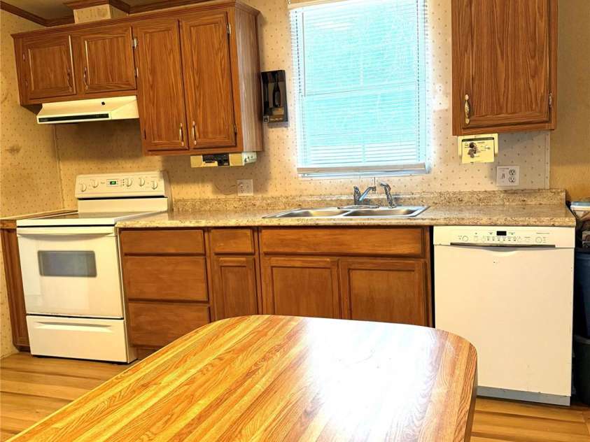 13080 Philadelphia Church Road, Oakboro, NC 28129.  MLS# CAR4222259, YatesRealty ID 2219. Window looking onto deck over sink