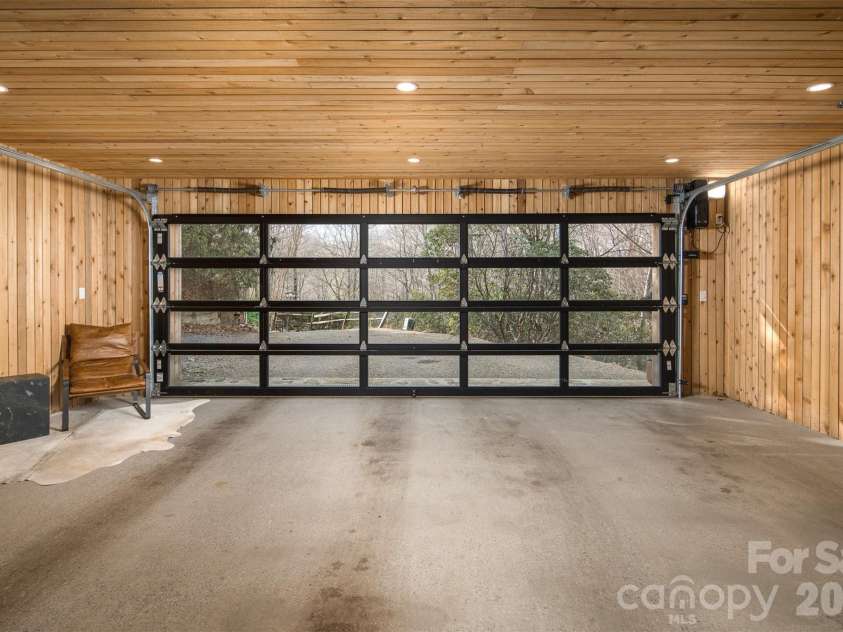 206 Tsisdvna Lane, Brevard, NC 28712.  MLS# CAR4334880, YatesRealty ID 2219. Glass Garage Door