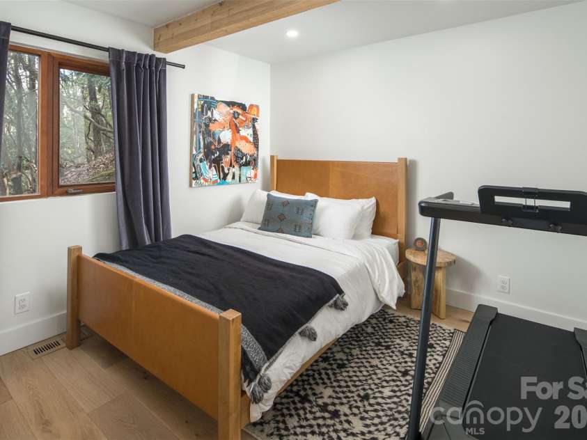 206 Tsisdvna Lane, Brevard, NC 28712.  MLS# CAR4334880, YatesRealty ID 2219. Main Level Guest Bedroom