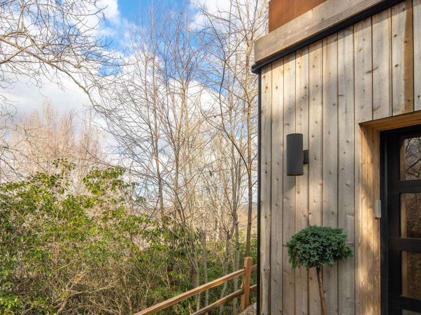 206 Tsisdvna Lane, Brevard, NC 28712.  MLS# CAR4334880, YatesRealty ID 2219. Natural Cedar Cladding exterior