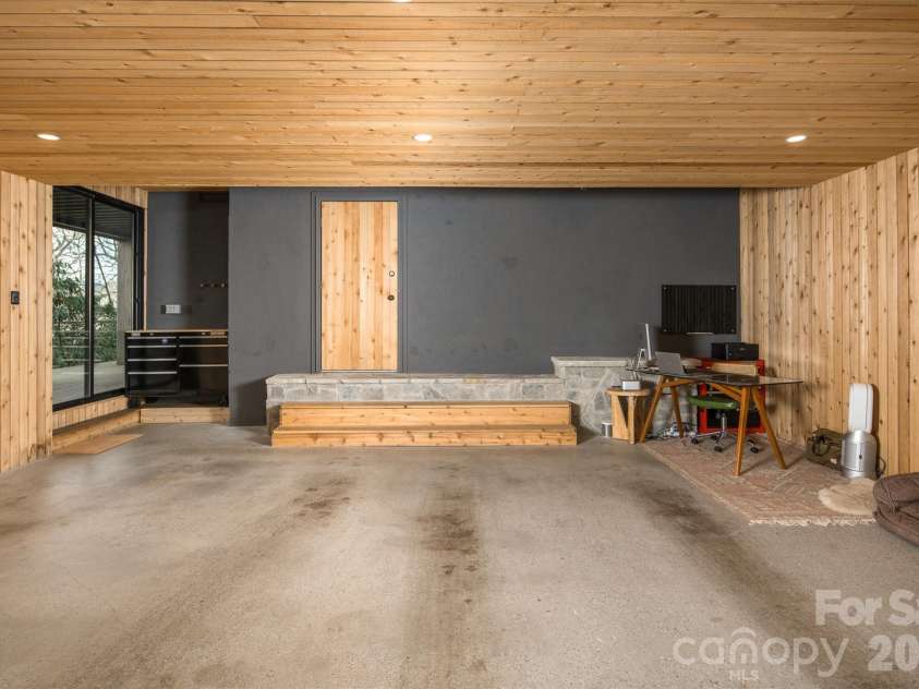 206 Tsisdvna Lane, Brevard, NC 28712.  MLS# CAR4334880, YatesRealty ID 2219. Oversized, 2 car garage addition, clad entirely in Cedar