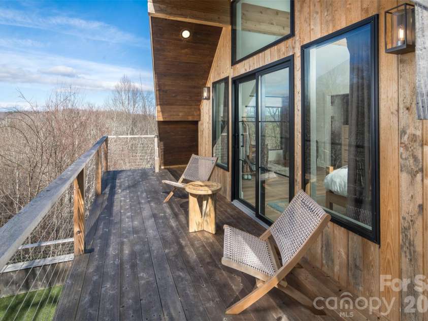 206 Tsisdvna Lane, Brevard, NC 28712.  MLS# CAR4334880, YatesRealty ID 2219. Private Balcony off Primary Suite for enjoying Long Range Mountain Views