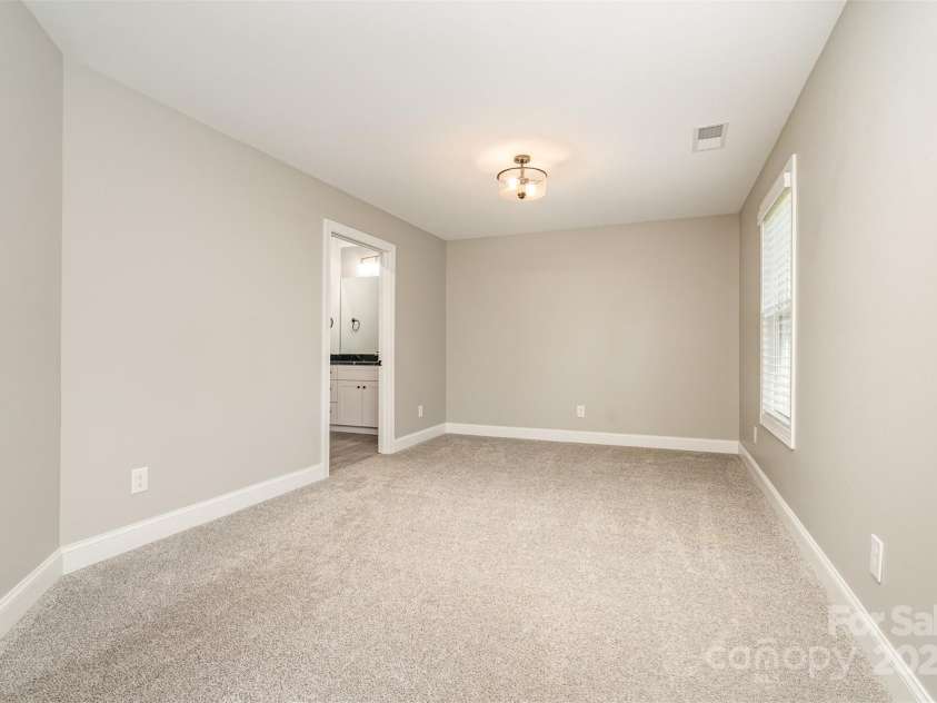 3011 Waxhaw Crossing Drive, Waxhaw, NC 28173.  MLS# CAR4315709, YatesRealty ID 22193. Private sitting room in Primary Bedroom