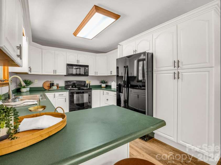 2304 Mountain Page Road, Saluda, NC 28773.  MLS# CAR4366725, YatesRealty ID 22195. Bright kitchen with breakfast bar