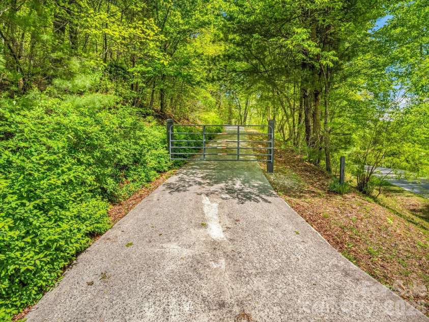 2304 Mountain Page Road, Saluda, NC 28773.  MLS# CAR4366725, YatesRealty ID 22195. Private Gated Driveway