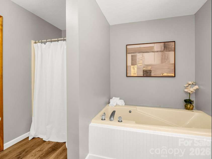 2304 Mountain Page Road, Saluda, NC 28773.  MLS# CAR4366725, YatesRealty ID 22195. Upper Level Primary FULL BATH with soaking tub