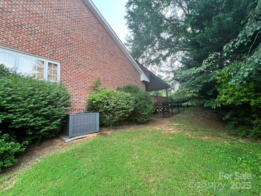 1344 Moonshadow Lane, Shelby, NC 28150.  MLS# CAR4274904, YatesRealty ID 22196. Right Exterior with Fence and Backyard View