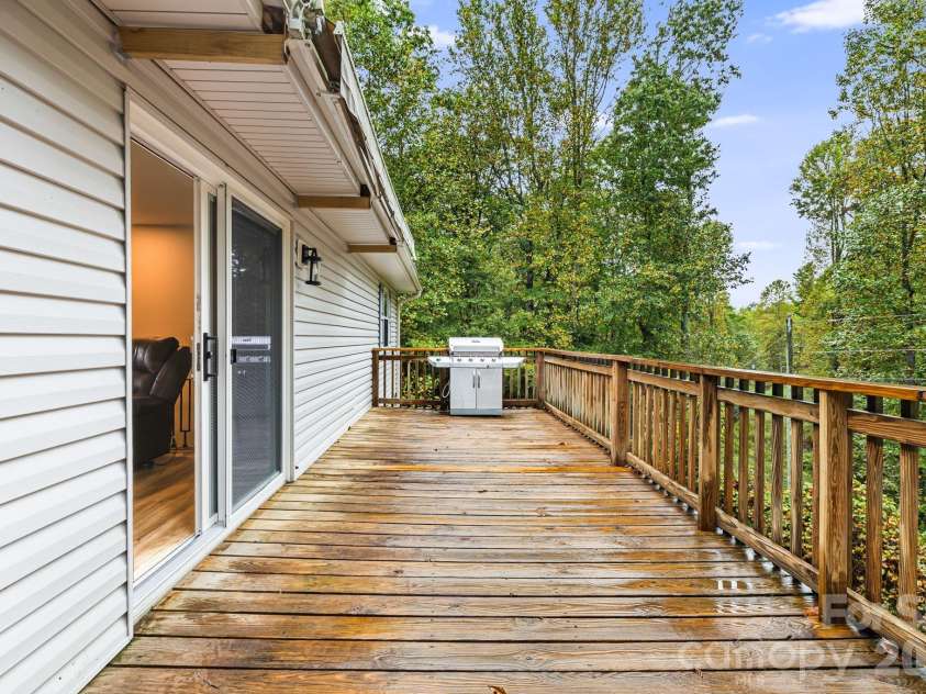 1007 Dula Road, Spruce Pine, NC 28777.  MLS# CAR4307434, YatesRealty ID 22203. Back deck with awning
