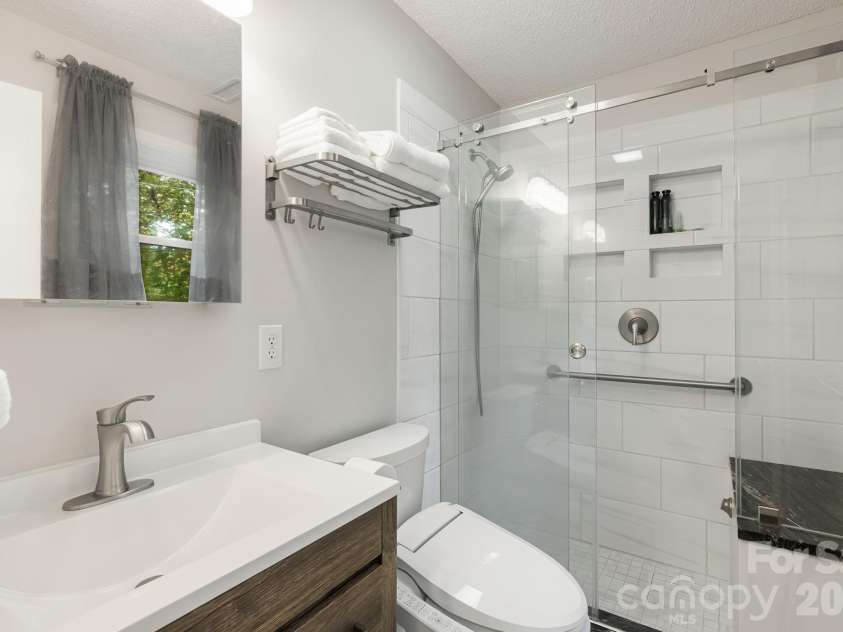1007 Dula Road, Spruce Pine, NC 28777.  MLS# CAR4307434, YatesRealty ID 22203. Primary bedroom ensuite