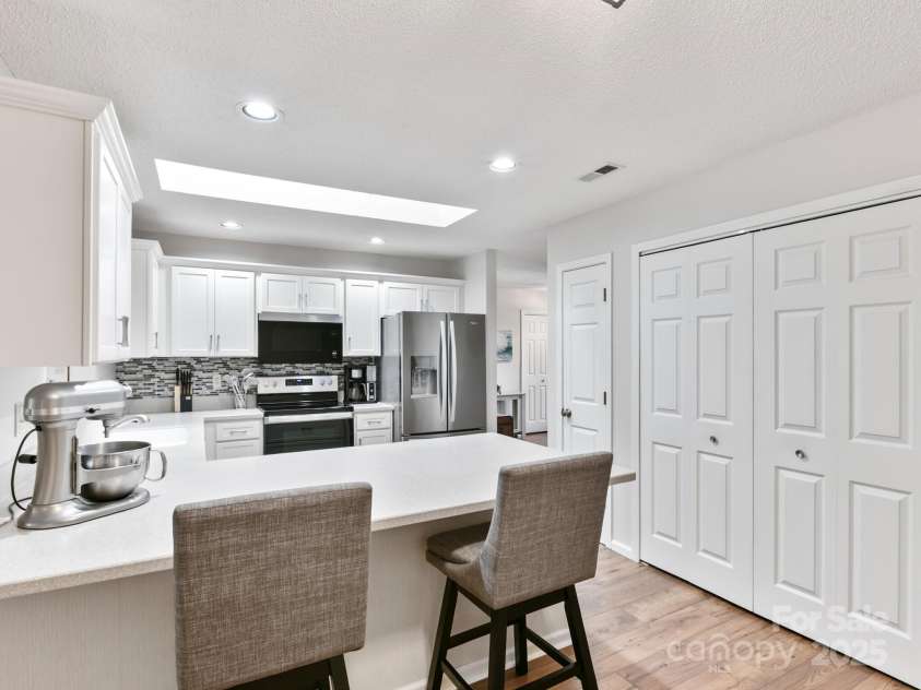 670 New Village Drive, Hendersonville, NC 28791.  MLS# CAR4272117, YatesRealty ID 22206. Laundry off kitchen