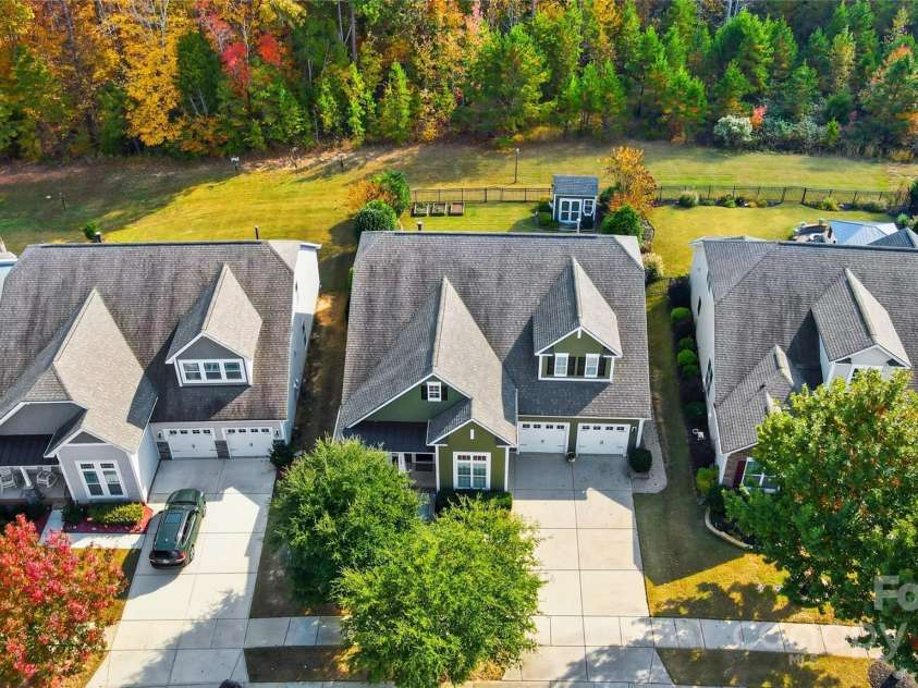 4069 Henshaw Road, Waxhaw, NC 28173.  MLS# CAR4323046, YatesRealty ID 2221. Flat level homesite backing to HOA. Beautiful wooded backdrop.