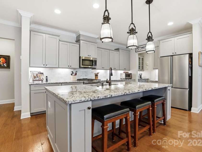 4069 Henshaw Road, Waxhaw, NC 28173.  MLS# CAR4323046, YatesRealty ID 2221. Large kitchen island with bar seating.