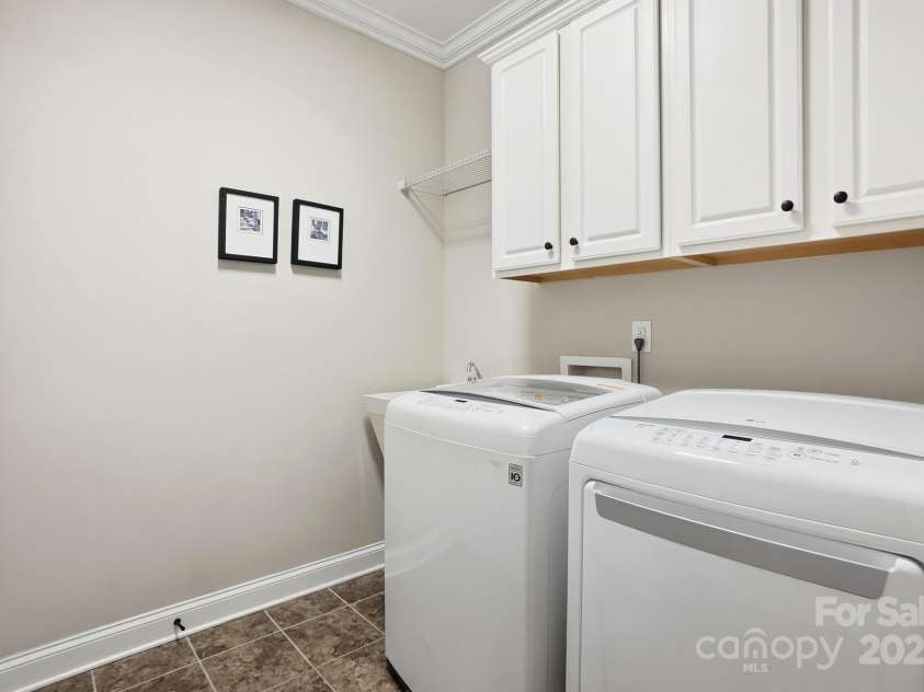 4069 Henshaw Road, Waxhaw, NC 28173.  MLS# CAR4323046, YatesRealty ID 2221. Laundry room with utility sink.
