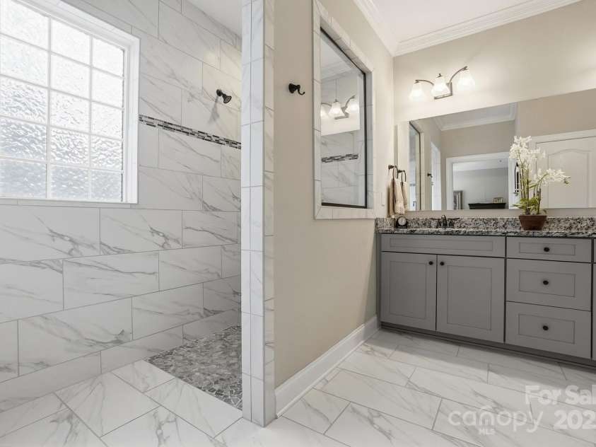 4069 Henshaw Road, Waxhaw, NC 28173.  MLS# CAR4323046, YatesRealty ID 2221. Owner's bath with huge walk in shower.
