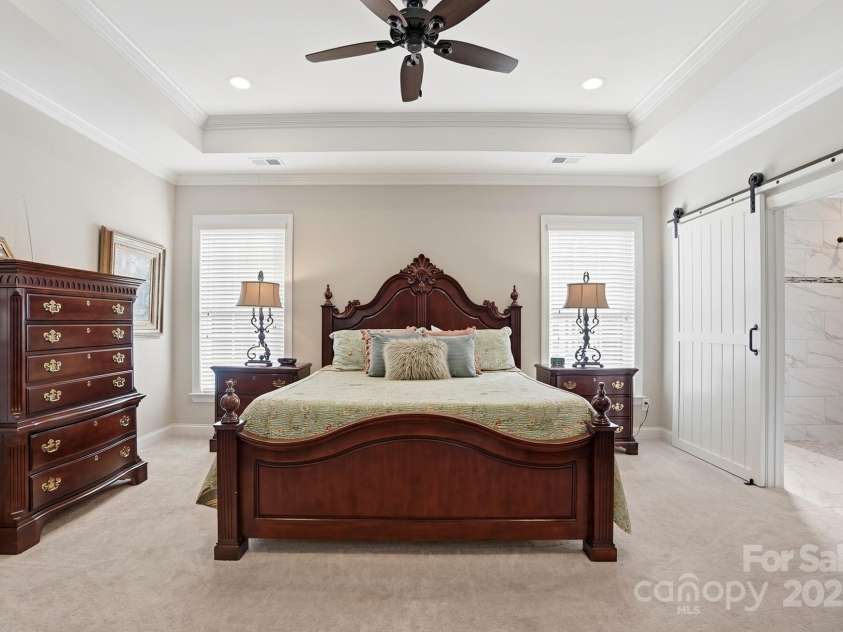 4069 Henshaw Road, Waxhaw, NC 28173.  MLS# CAR4323046, YatesRealty ID 2221. Spacious owner's suite with custom farm door.