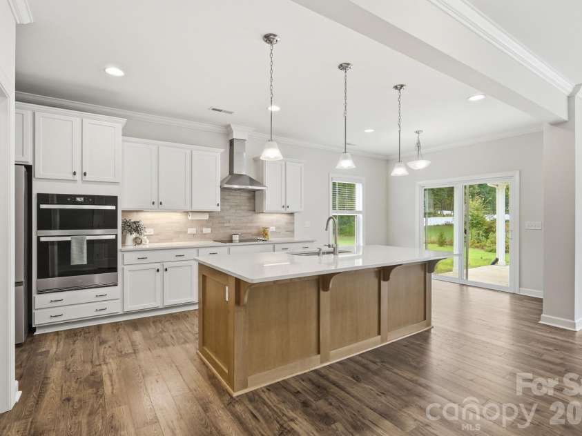 5670 Galloway Drive, Midland, NC 28107.  MLS# CAR4412132, YatesRealty ID 22226. Kitchen with large island and wall over/microwave