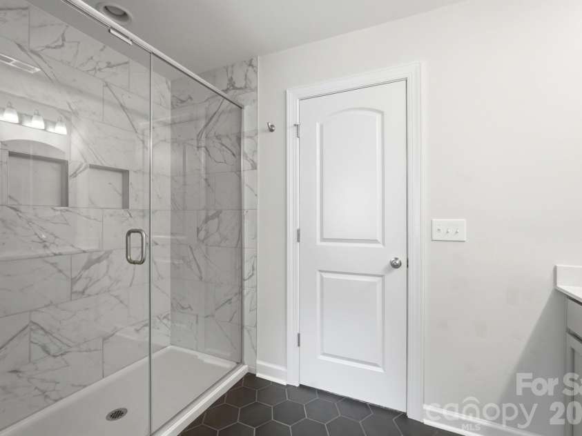 5670 Galloway Drive, Midland, NC 28107.  MLS# CAR4412132, YatesRealty ID 22226. Walk in shower in primary bath