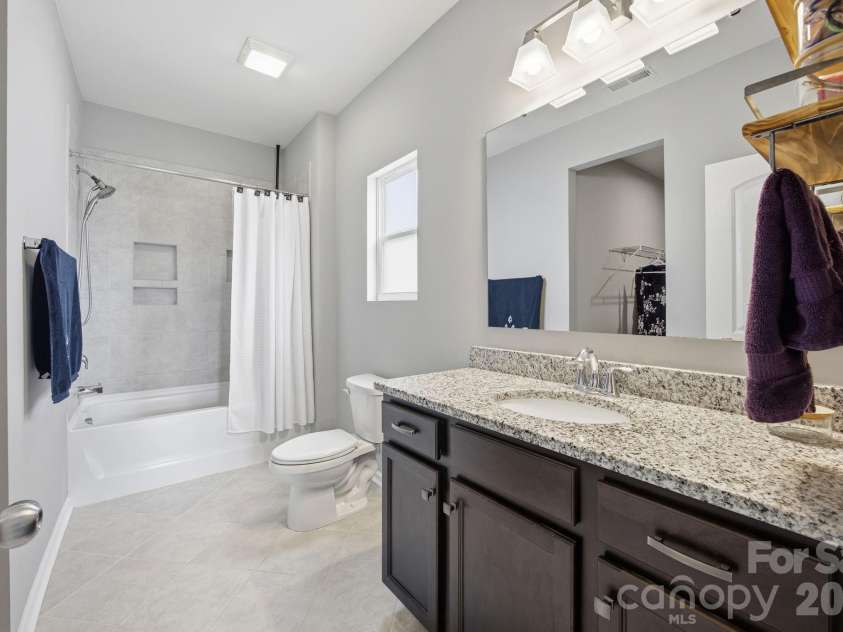 315 Prosperous Path, Locust, NC 28097.  MLS# CAR4377874, YatesRealty ID 22230. Ensuite bath with granite and tile