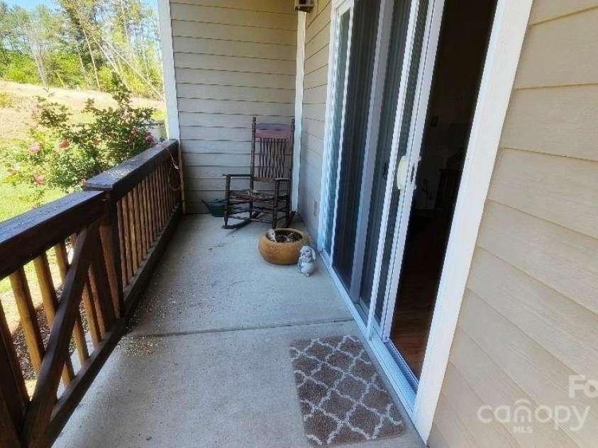 93 Foxden Drive, Fletcher, NC 28732.  MLS# CAR4251885, YatesRealty ID 22237. Back patio