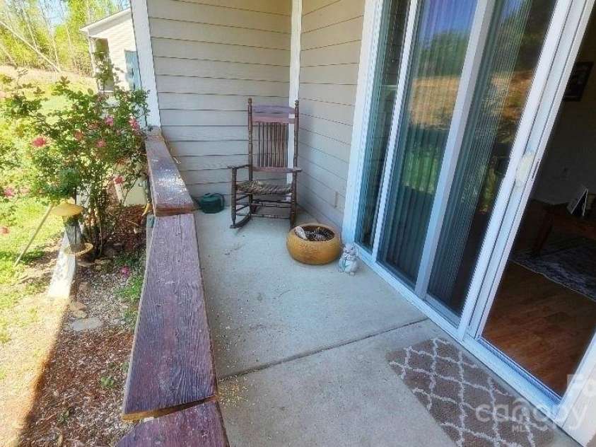 93 Foxden Drive, Fletcher, NC 28732.  MLS# CAR4251885, YatesRealty ID 22237. Back patio