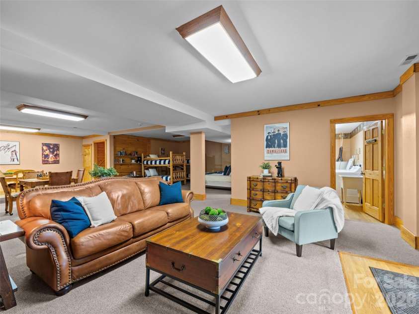 134 McDaniel Court, Lake Lure, NC 28746.  MLS# CAR4340805, YatesRealty ID 2224. Den located downstairs with gas logs