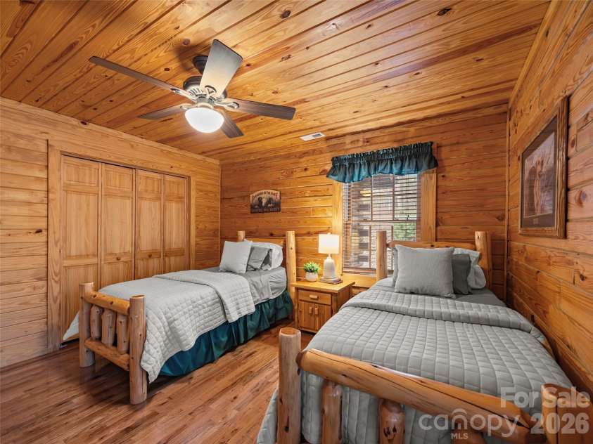 134 McDaniel Court, Lake Lure, NC 28746.  MLS# CAR4340805, YatesRealty ID 2224. Guest bedroom on main floor