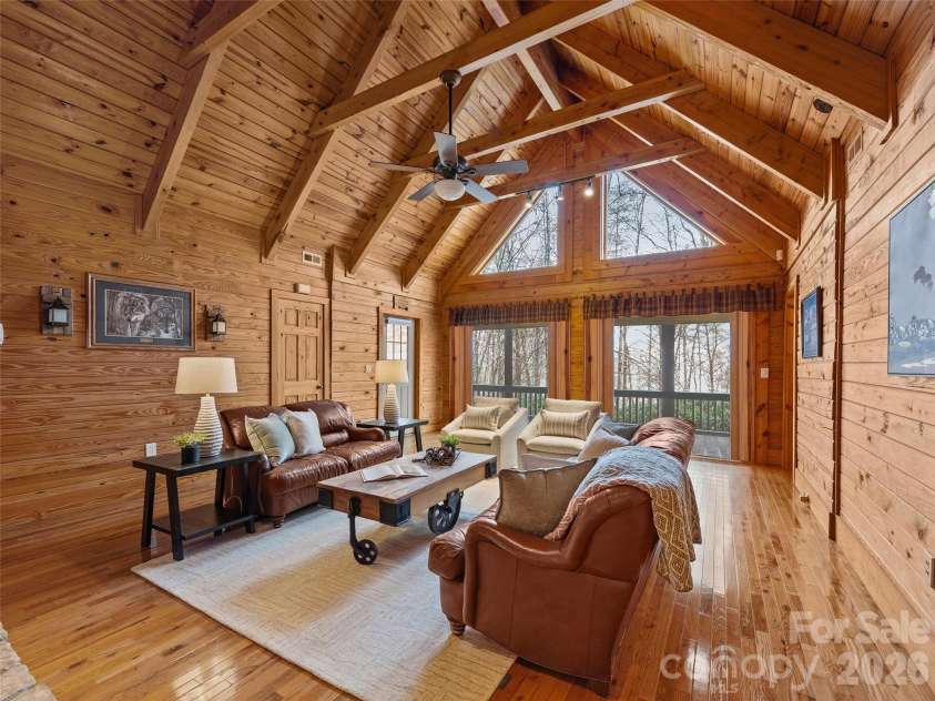 134 McDaniel Court, Lake Lure, NC 28746.  MLS# CAR4340805, YatesRealty ID 2224. Living room-double sliding glass doors