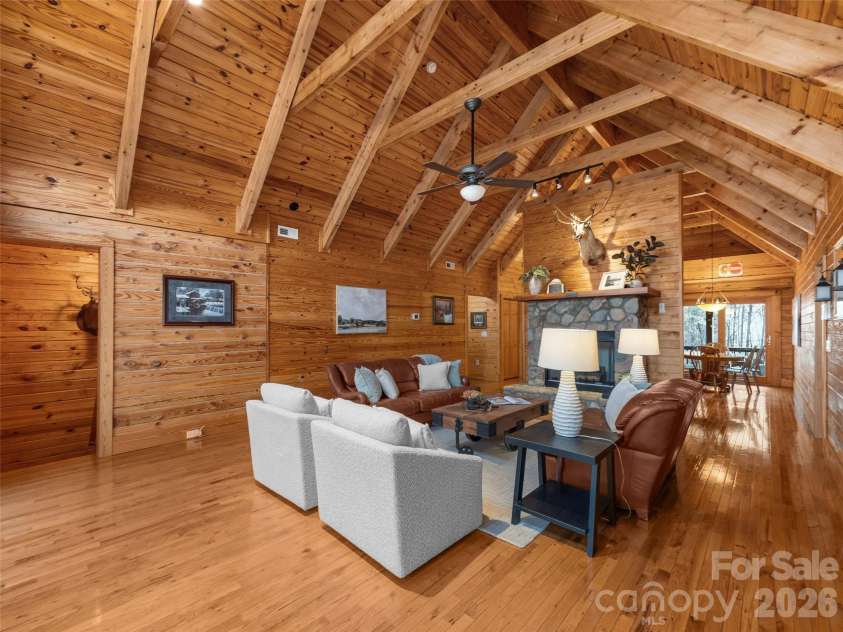 134 McDaniel Court, Lake Lure, NC 28746.  MLS# CAR4340805, YatesRealty ID 2224. Living Room with vaulted ceilings and gas fireplace