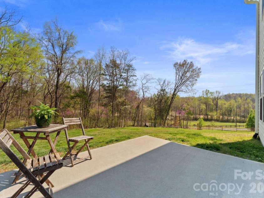 467 Hoover Road, Troutman, NC 28166.  MLS# CAR4360808, YatesRealty ID 22250. Beauriful scenic backyard with creek.