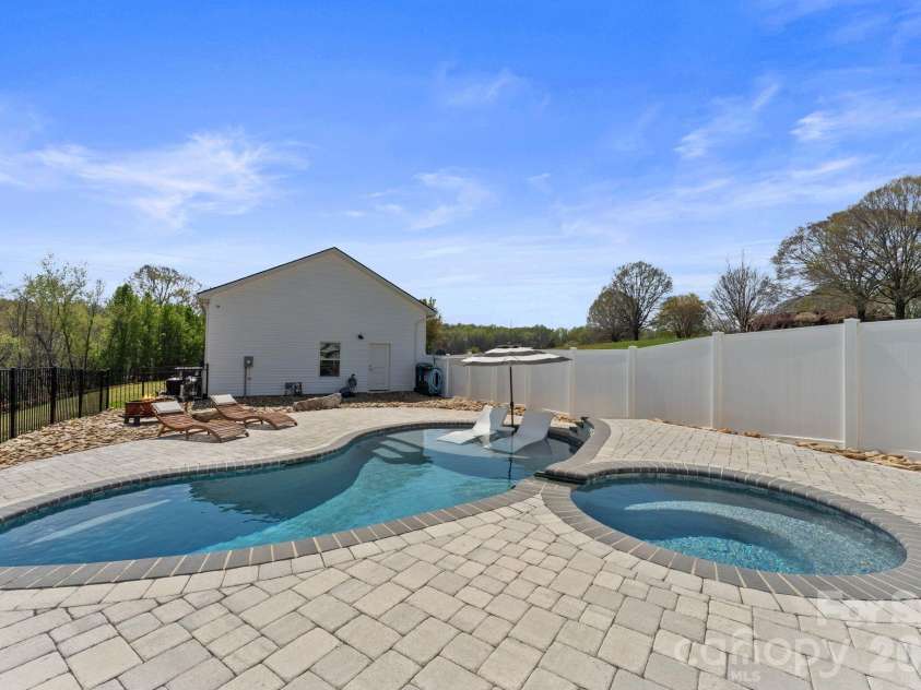 467 Hoover Road, Troutman, NC 28166.  MLS# CAR4360808, YatesRealty ID 22250. Inground heated Pool