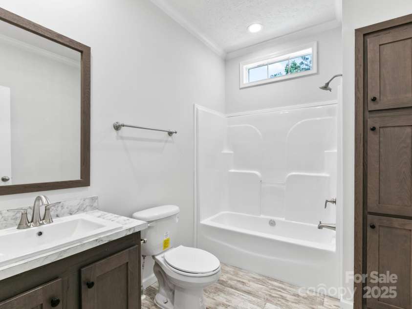 208 Walnut Branch Road, Weaverville, NC 28787.  MLS# CAR4272561, YatesRealty ID 22254. Hall Bathroom